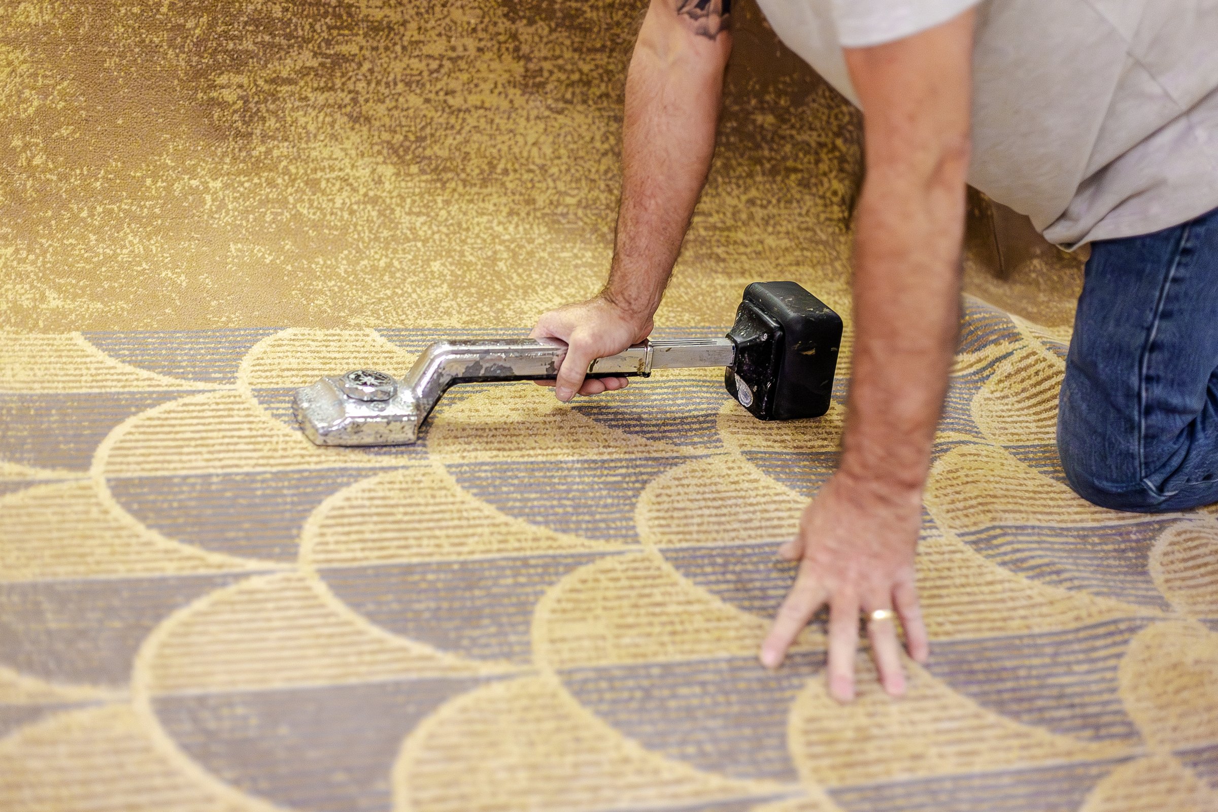 Fitting carpet with a knee kicker at Hilton Heathrow Terminal 5